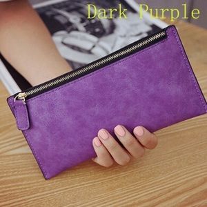 Woman’s faux leather zip wallet.